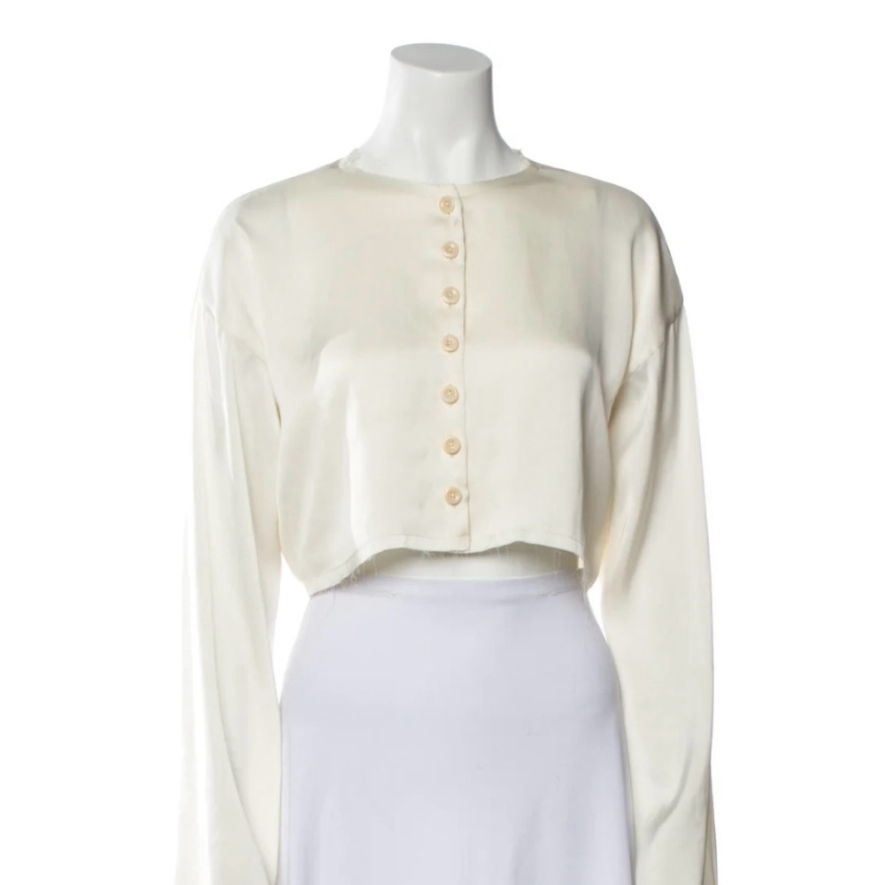 Orseund Iris cropped frayed blouse in cream with bell sleeves